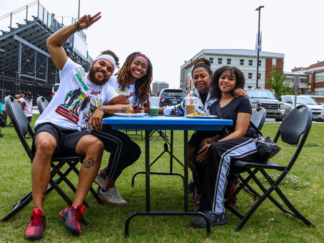 diverse young adult community volunteers at holistic wellness festival