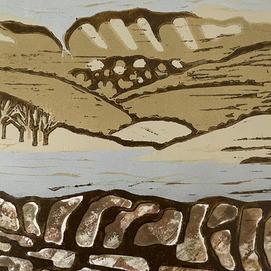 A view over a drystone wall towards Kinder Reservoir.