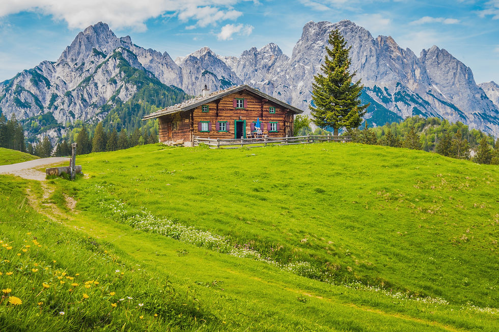 Swiss Alpine meadow and cottage