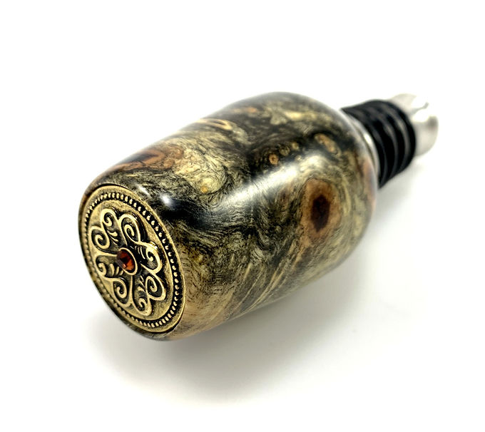 Wooden Buckeye burl bottle stopper top with silicone and stainless steel stopper.