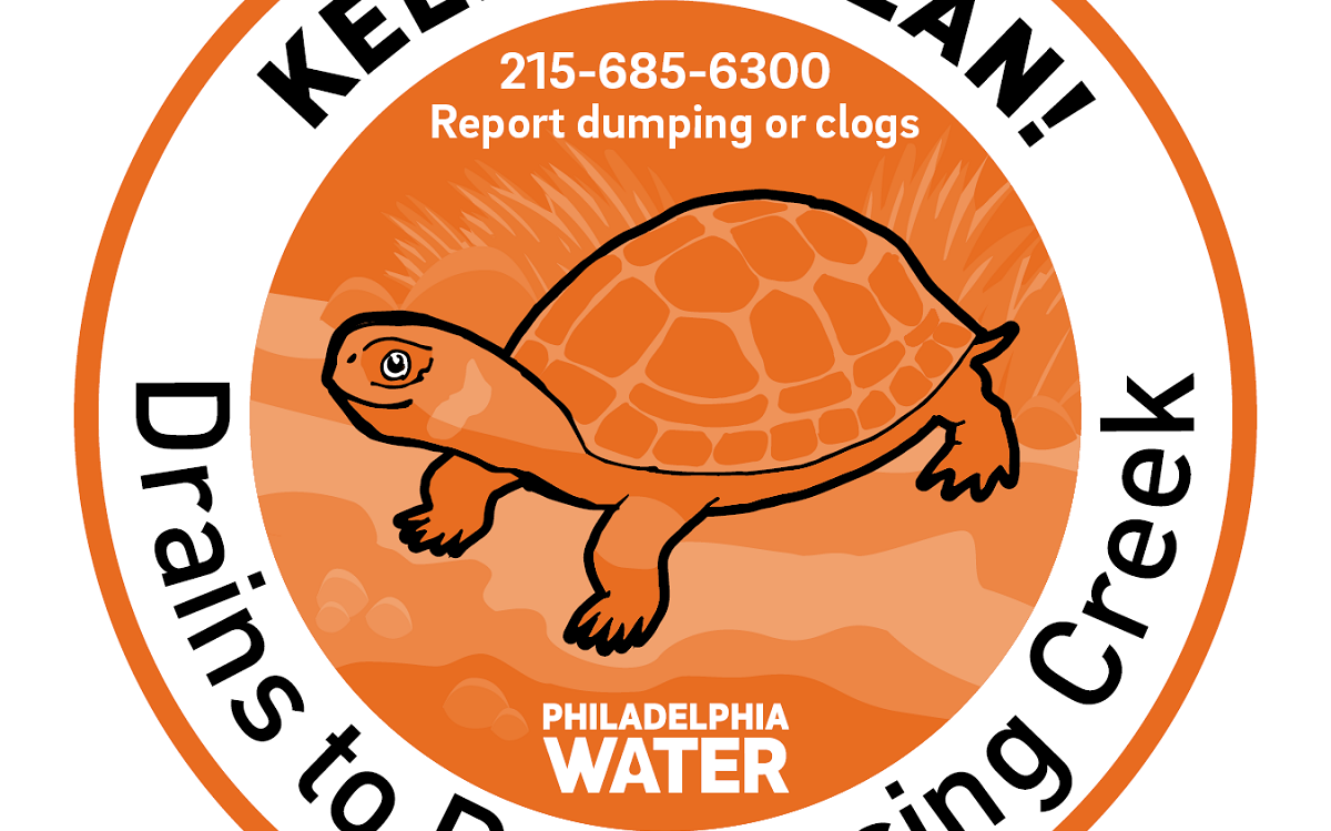 A round emblem with an image of a turtle.