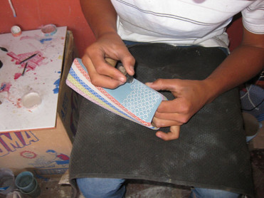 By hand.