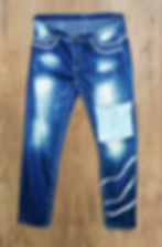 Product image of faded straight leg Jeans on a Wood Background