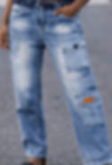 Man wearing faded denim jeans with double leg pocket design