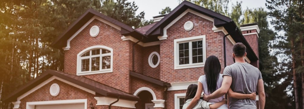 family in front of house 3.jpg