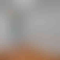 Unfurnished laundry room with wood-look flooring, white walls, washer and dryer hookups, and an open door leading to an unfinished basement with mechanical equipment.