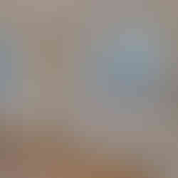 Full bathroom with large windows providing natural light, a built-in soaking tub with chrome fixtures, a glass-enclosed shower, a white closed lid toilet, and a vanity with granite countertop, with wood-look flooring.