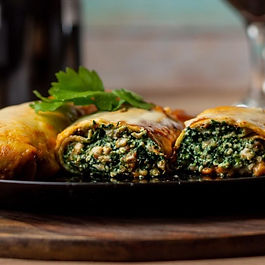 1. Heat olive oil in a pan and lightly wilt the spinach
2. Place tortilla on a flat surface
3. Spread spinach evenly on the tortilla
4. Crumble feta cheese over the top
5. Roll up the wrap tightly
6. Optional: Toast the wrap briefly in a pan for a warm, crispy texture
7. Slice and serve