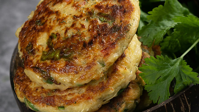 1. In a bowl, mix corn, flour, egg, and a pinch of salt until combined
2. Heat oil in a skillet over medium heat
3. Drop spoonfuls of batter into the pan
4. Flatten slightly with a spatula
5. Cook for 2–3 minutes on each side until golden and crispy
6. Drain on paper towels and serve warm, optionally with yogurt or chili dip