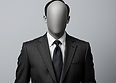 a faceless man in a suit.jpg