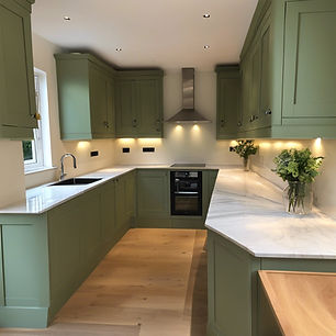 Elegant kitchen design with custom cabinetry and with hardwood accents
