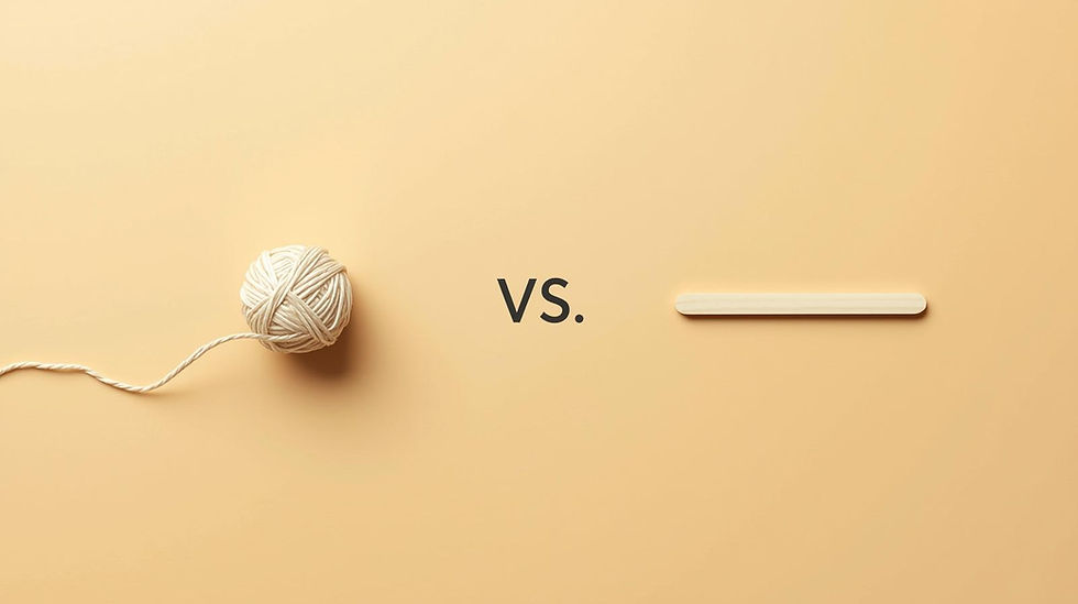 Lit amber jar candle on a wooden surface with a trimmed wick and soft warm light, clean minimal background