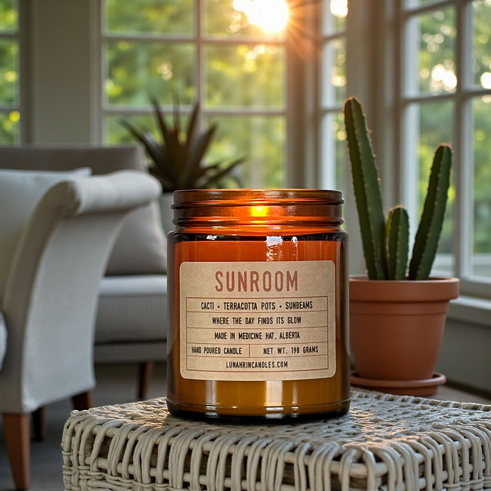 Hand-poured Sunroom candle in amber glass jar, evoking sunlight through windows and a calm, airy atmosphere