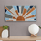 Thumbnail: Light House Laser Art's laser cut wood panel wall art featuring a hand painted sun.