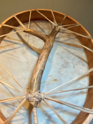 View of oval natural shamanic drum for sale with wooden handle