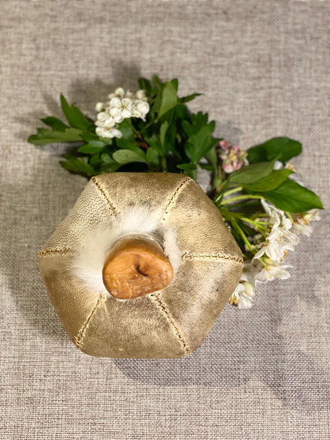 View of a shamanic rattle made from deer skin and cherry wood