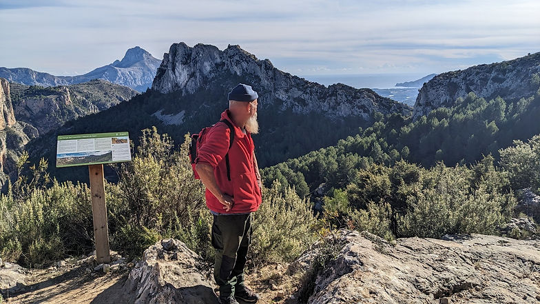An explorer looks out from the mountains of Marinas Bajas, Costa Blanca