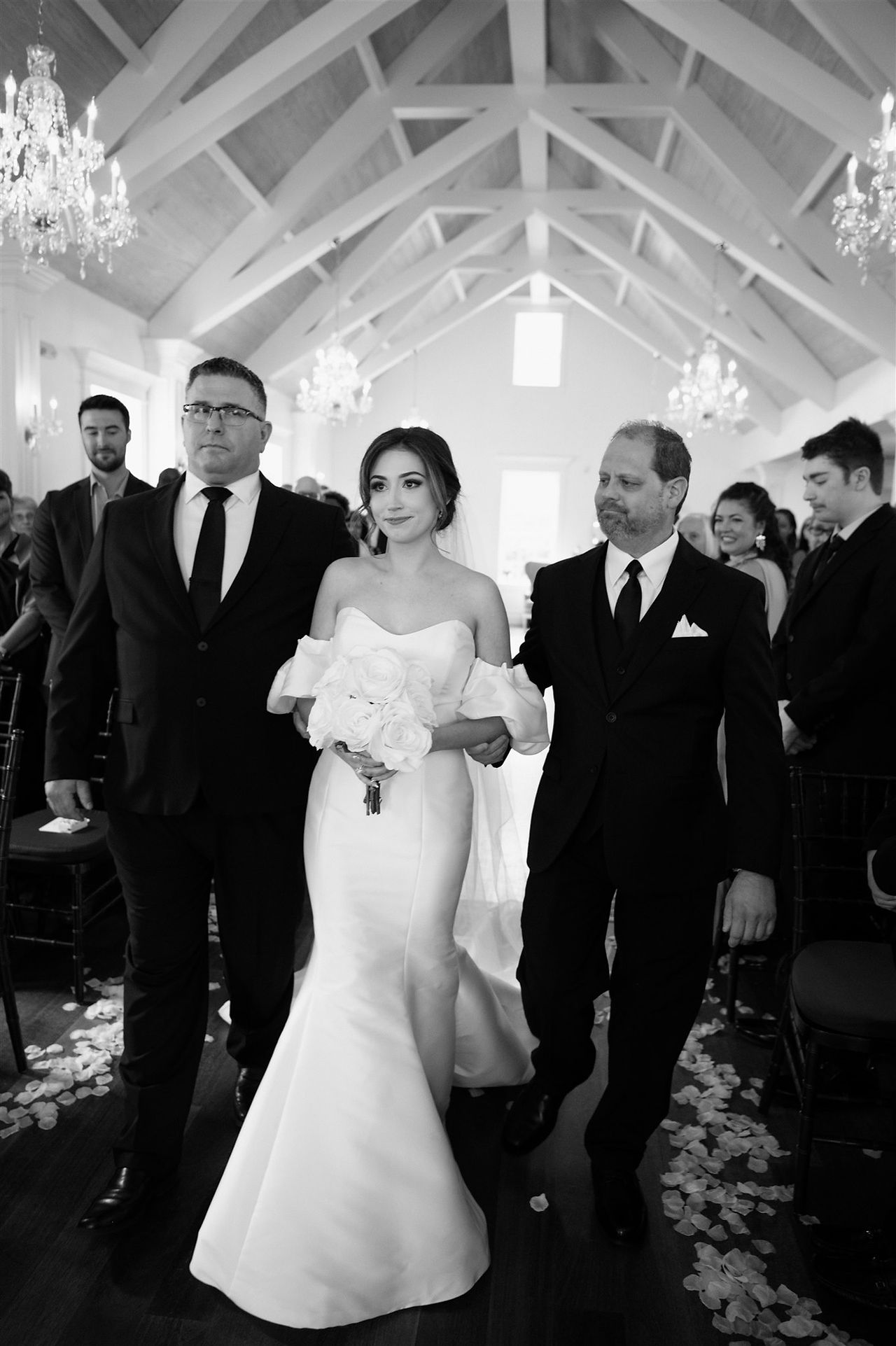 bride going down the aisle at the white room