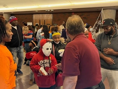 Children in Halloween costumes at court event with adults
