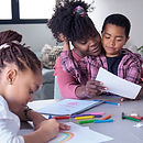 african-mother-painting-with-her-son-and-niece-dur-2023-11-27-05-15-33-utc copy.jpg