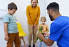 young-multiracial-dentist-playing-with-kids-at-his-2024-10-20-15-14-31-utc.jpg