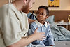dad-talking-to-black-boy-sitting-in-bedroom-raisin-2025-03-08-21-13-10-utc.jpg