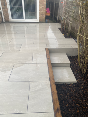 Porcelain patio steps sleeper wall Wickford