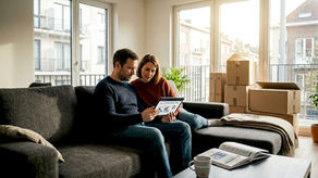 Expats consult satellite TV guide in Brussels apartment