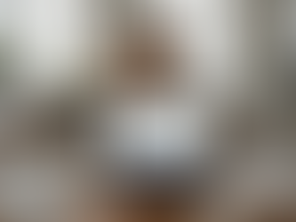 Woman comparing handyman websites at kitchen table