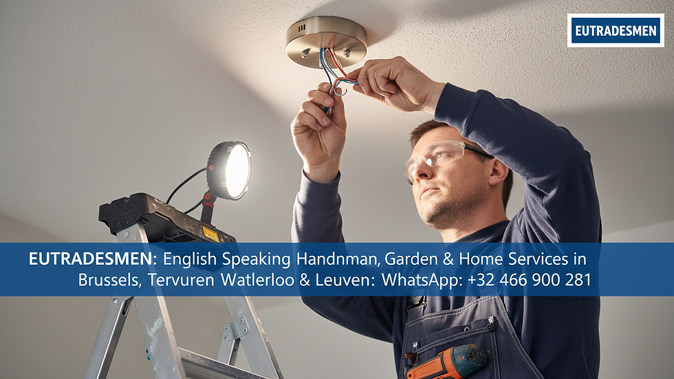 Close-up view of a handyman installing a light fixture on a ceiling