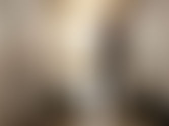 Electrician inspecting circuit panel in Brussels hallway