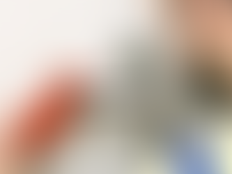 Plumber working under Brussels apartment sink