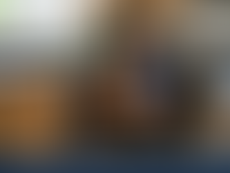 English speaking handyman fixes a plumbing issues under a sink in Leuven.