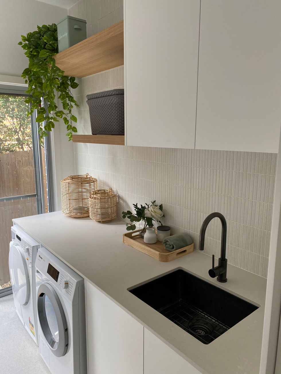 We added Japanese Kit Kat tiles to the splashback and oak shelving to bring some warmth and texture.