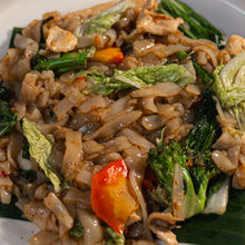 A Thai street food favorite featuring flat rice noodles stir fried with Thai basil, fresh chili, vegetables, and your choice of protein.