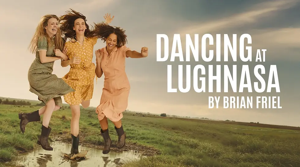 Three women joyfully jump in a grassy field, wearing colorful dresses and boots. Text reads Dancing at Lughnasa by Brian Friel.