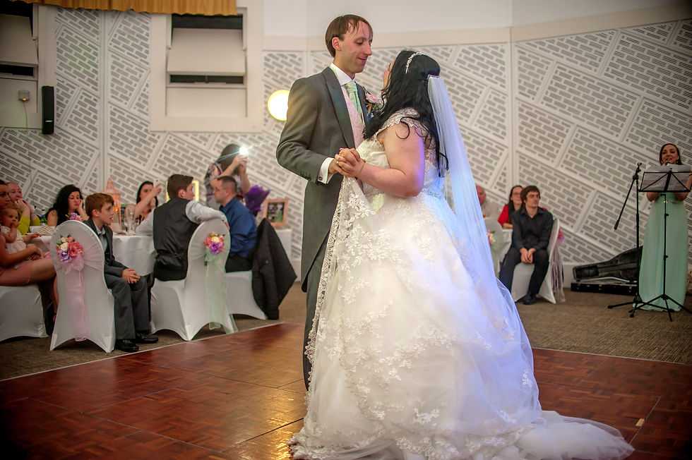 arah and Lawrence having their first dance while Rachel performs their first-dance song live at their wedding reception.