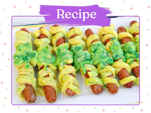 Hot dogs wrapped in green and yellow pastry strips, resembling Halloween mummies. Purple banner with "Recipe" text. Festive vibe.