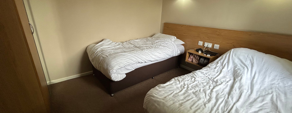 Twin bedroom in the Diamond Cottage at Ribby Hall Village with two single beds and wardrobe storage