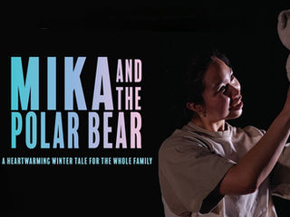 Person holding a plush polar bear joyfully. Text: "Mika and the Polar Bear. A heartwarming winter tale for the whole family." Black background.