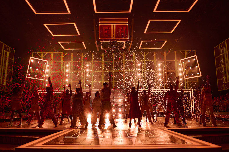 The High School Musical cast perform on the East High basketball court as confetti falls across the stage at The Lowry.