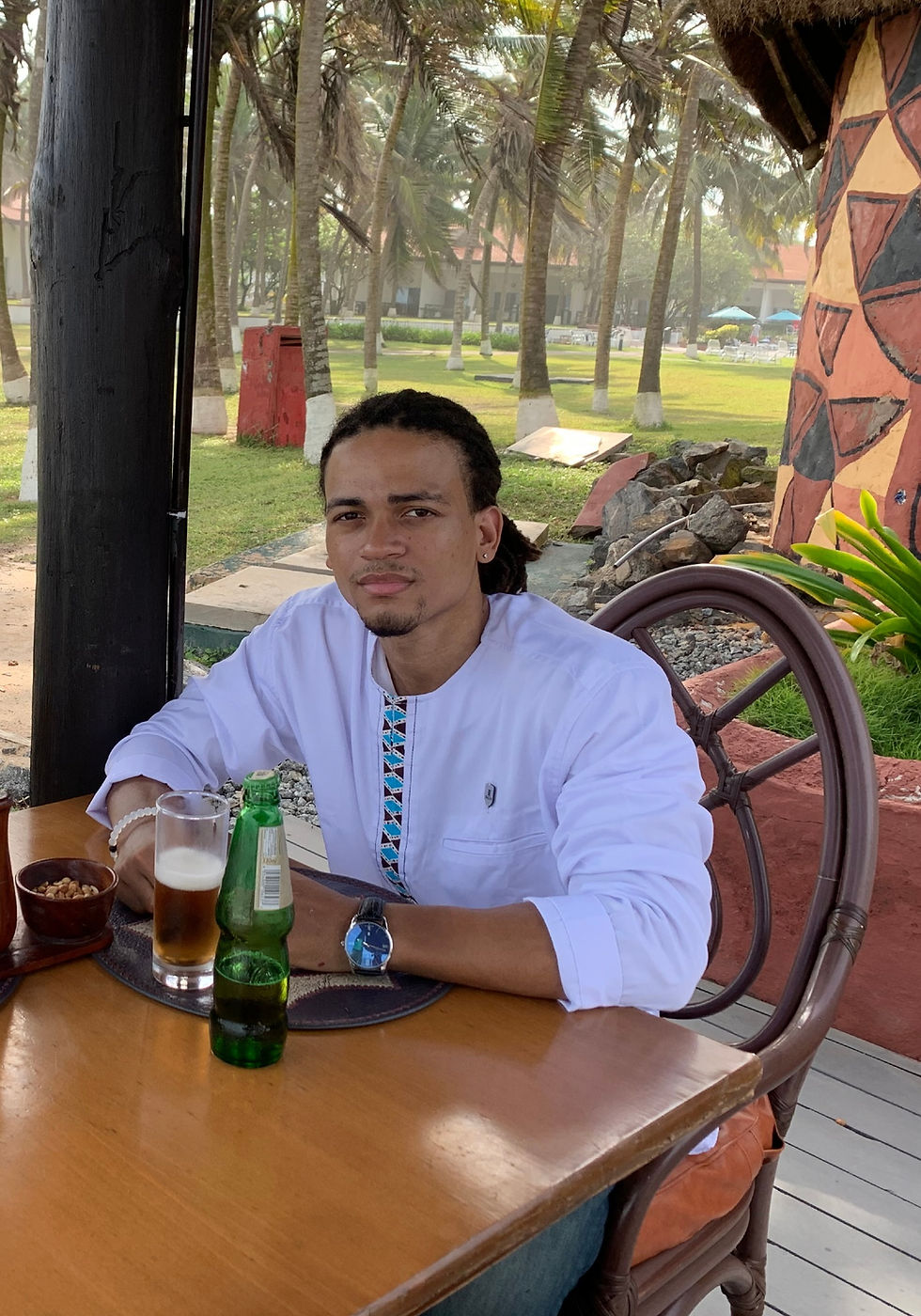 Picture of me sitting at a table during a real estate meeting in Accra, Ghana.