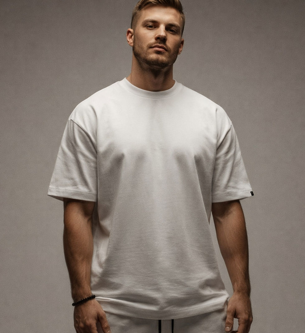 Man wearing an oversized white tee shirt.
