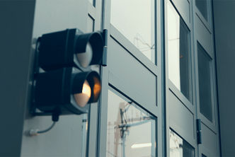Signal light beside a folding door at Scheveningen Tram Depot.