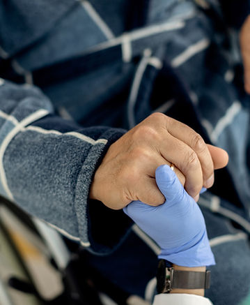 closeup-senior-man-home-caregiver-holding-hands (1).jpg