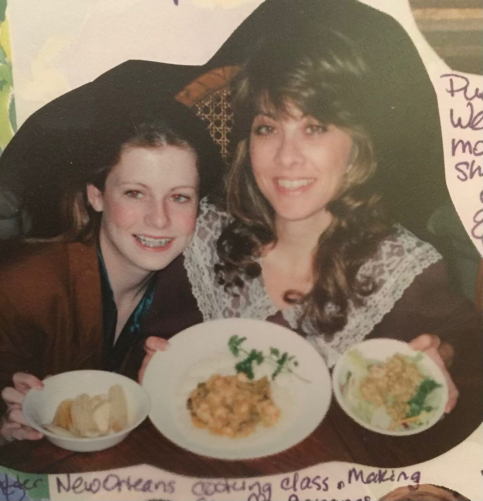 My mother and I cooking all our New Orleans taught dishes at home with me, proudly holding my favorite, our Bananas Foster. Image c/o Helene Van Sant-Klein