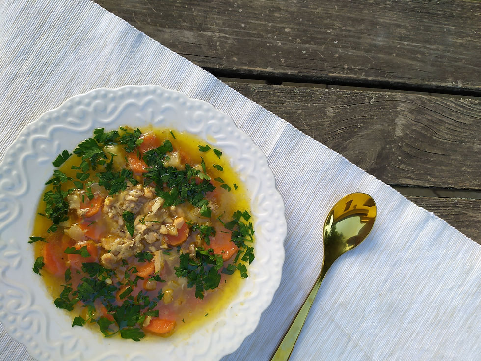 chicken soup in white dish