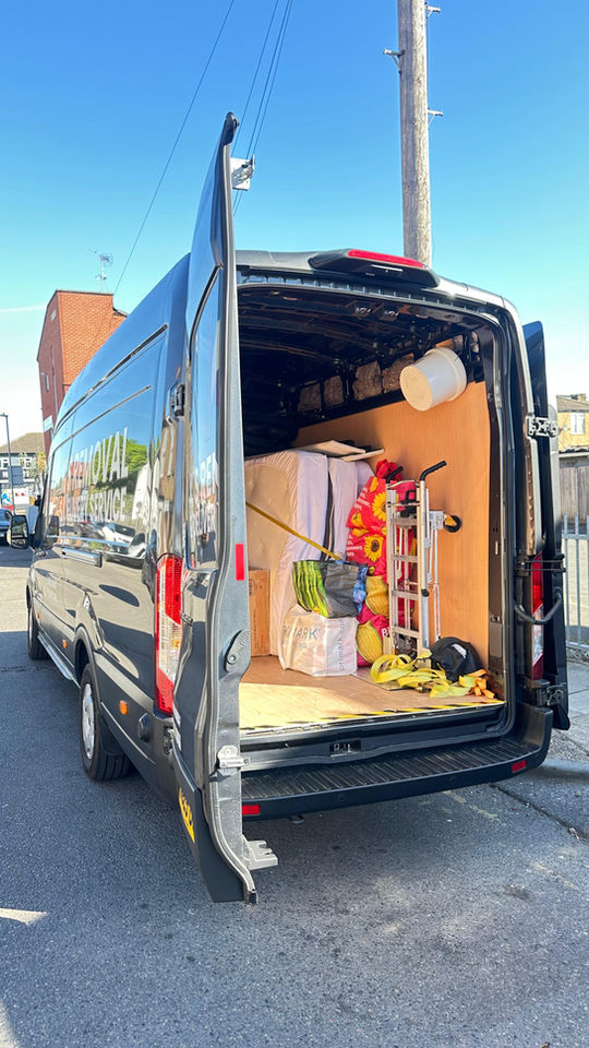 Inside the back of the removal and delivery van with strap, bags, primark bag, mattress trolley carrier,