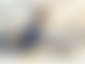 Manager reviews multilingual compliance documents at desk