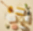 Various skincare products from Greens & Good on a beige background
